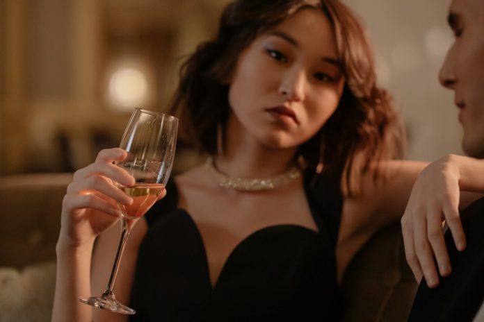 woman holding a glass of wine