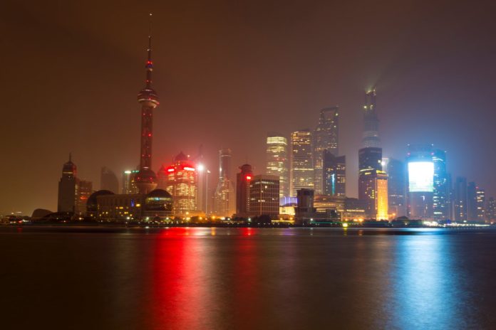 view of city buildings in the city during night time
