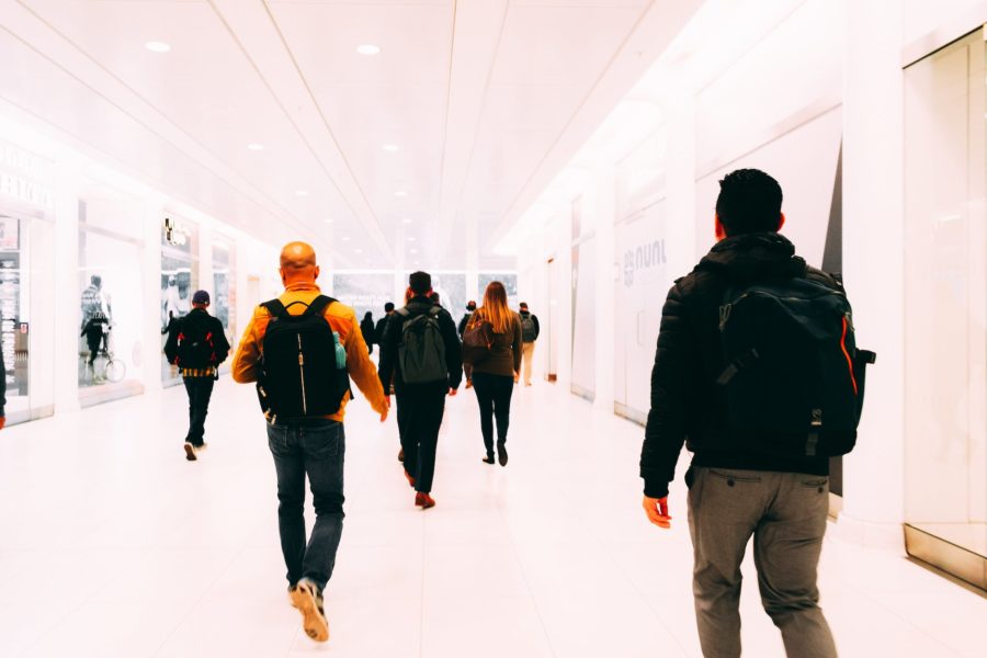 people walking on a hallway