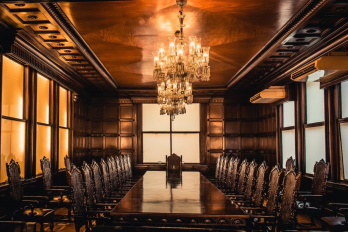 brown wooden table and chairs inside building