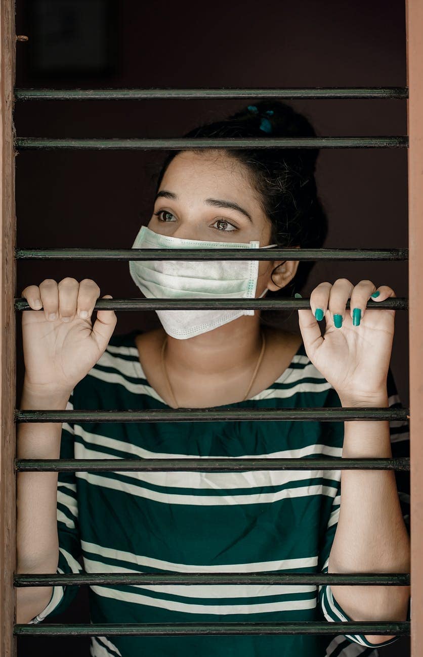 Do These 5 Things To Boost Your Confidence Post-Quarantine 2 woman in green and white stripe shirt covering her face with white mask