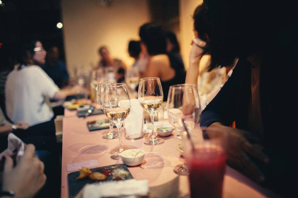 people having wine in a restaurant