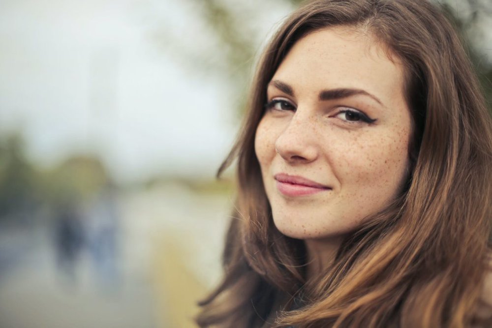 selective photography of smiling woman