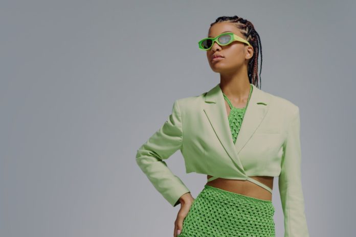 portrait of woman in green jacket and skirt