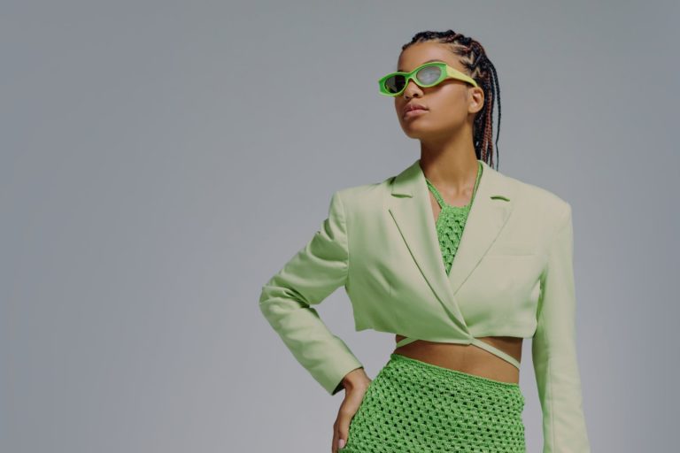 portrait of woman in green jacket and skirt