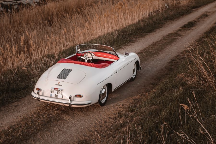a white car on a dirt road